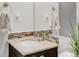 Elegant bathroom with granite countertop, modern fixtures, and a decorative mirror at 45 W Fremont Pl, Littleton, CO 80120
