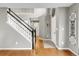 Bright entryway with hardwood floors, staircase, and modern decor at 45 W Fremont Pl, Littleton, CO 80120