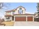 Charming two-story home boasts a three-car garage and well-maintained front yard at 45 W Fremont Pl, Littleton, CO 80120