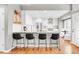 Spacious kitchen with a breakfast bar, stainless steel appliances, and white cabinets at 45 W Fremont Pl, Littleton, CO 80120