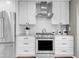 Well-equipped kitchen featuring stainless steel appliances and subway tile backsplash at 45 W Fremont Pl, Littleton, CO 80120
