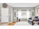 Cozy living room featuring hardwood floors, large window, and comfortable seating at 45 W Fremont Pl, Littleton, CO 80120