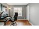 Home office featuring hardwood floors, a large desk, and a comfortable executive chair at 45 W Fremont Pl, Littleton, CO 80120