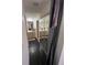 Hallway view of a stylish bathroom with a mirror-door closet and a double sink vanity at 14141 E Baltic Pl, Aurora, CO 80014