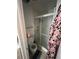 Compact bathroom with a toilet and a shower featuring sliding glass doors at 14141 E Baltic Pl, Aurora, CO 80014