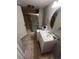 Bathroom featuring a vanity sink, tiled floors, and a glass-enclosed shower at 14141 E Baltic Pl, Aurora, CO 80014