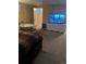 Bedroom featuring a bed, TV, and cozy atmosphere at 14141 E Baltic Pl, Aurora, CO 80014