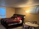 Bedroom with a bed, small table and a window with blinds at 14141 E Baltic Pl, Aurora, CO 80014