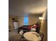 Bedroom with a bed, small table and a window at 14141 E Baltic Pl, Aurora, CO 80014
