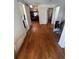 Inviting hallway featuring beautiful hardwood floors and access to multiple rooms at 14141 E Baltic Pl, Aurora, CO 80014