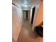 Hallway with tiled floors, closet space, and doors to rooms at 14141 E Baltic Pl, Aurora, CO 80014