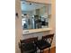 Breakfast bar with kitchen view featuring modern appliances and ample counter space at 14141 E Baltic Pl, Aurora, CO 80014
