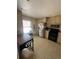 Bright kitchen with stainless steel appliances, light cabinets, and durable flooring at 14141 E Baltic Pl, Aurora, CO 80014