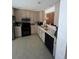 Well-lit kitchen featuring modern appliances, ample cabinet space, and light countertops at 14141 E Baltic Pl, Aurora, CO 80014