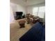 Comfortable living room with cozy furniture and natural light from a window at 14141 E Baltic Pl, Aurora, CO 80014