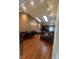 Spacious living room with hardwood floors, skylights, and stylish decor at 14141 E Baltic Pl, Aurora, CO 80014