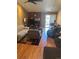 Comfortable living room featuring cozy seating, a fireplace, and natural light at 14141 E Baltic Pl, Aurora, CO 80014