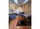 Open living space with hardwood floors, skylights, and comfortable furniture at 14141 E Baltic Pl, Aurora, CO 80014