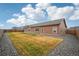 Lovely backyard features grass, gravel landscaping, and a charming exterior view at 56432 E 23Rd Ave, Strasburg, CO 80136