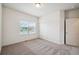 Bedroom with window, closet, and neutral carpet, offering space and functionality at 56432 E 23Rd Ave, Strasburg, CO 80136