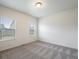 Light-filled bedroom with a large window overlooking the neighborhood at 56432 E 23Rd Ave, Strasburg, CO 80136