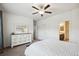 Bright bedroom featuring carpet, neutral walls, and view to bathroom at 56432 E 23Rd Ave, Strasburg, CO 80136