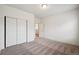 Bedroom featuring carpet and a closet, offering functionality and space at 56432 E 23Rd Ave, Strasburg, CO 80136