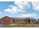 Charming one-story home with a well-maintained front yard and inviting curb appeal at 56432 E 23Rd Ave, Strasburg, CO 80136