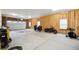 Large garage featuring a pair of motorcycles, and a well-organized interior at 56432 E 23Rd Ave, Strasburg, CO 80136