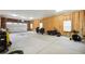 Large garage featuring a pair of motorcycles, and a well-organized interior at 56432 E 23Rd Ave, Strasburg, CO 80136