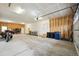 Well-lit garage offering ample storage and parking space, complete with utility hookups at 56432 E 23Rd Ave, Strasburg, CO 80136
