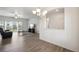 Bright and airy living area with wood floors, modern lighting, and sliding glass doors at 56432 E 23Rd Ave, Strasburg, CO 80136