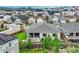 Aerial view of a modern home with landscaping, a cozy patio, and a glimpse of the neighborhood at 1465 Gentle Rain Dr, Castle Rock, CO 80109