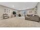 Spacious basement featuring a comfortable seating area and modern entertainment setup at 1465 Gentle Rain Dr, Castle Rock, CO 80109