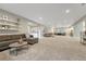 Large finished basement with a comfortable seating area, modern decor, and ample space at 1465 Gentle Rain Dr, Castle Rock, CO 80109