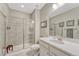 Modern bathroom featuring a glass-enclosed shower, sleek vanity, and neutral tile work, providing a spa-like experience at 1465 Gentle Rain Dr, Castle Rock, CO 80109