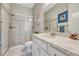 Modern bathroom with a glass-enclosed shower and a white vanity with granite countertop at 1465 Gentle Rain Dr, Castle Rock, CO 80109