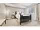 Serene bedroom with a dark wood bed frame, soft lighting, and neutral decor, creating a relaxing atmosphere at 1465 Gentle Rain Dr, Castle Rock, CO 80109