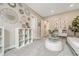 Inviting bedroom with decorative mirrors, a white bookcase, and a comfortable seating area at 1465 Gentle Rain Dr, Castle Rock, CO 80109