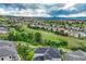 Panoramic view of a residential area with green spaces and well-maintained homes under a cloudy sky at 1465 Gentle Rain Dr, Castle Rock, CO 80109