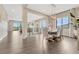 Open dining room with hardwood floors, lots of light and views of the living room at 1465 Gentle Rain Dr, Castle Rock, CO 80109