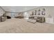 Expansive living room featuring neutral tones, plush carpeting, and stylish furnishings perfect for relaxation and entertaining at 1465 Gentle Rain Dr, Castle Rock, CO 80109