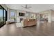 Spacious living room with hardwood floors, fireplace, large windows and high ceilings at 1465 Gentle Rain Dr, Castle Rock, CO 80109