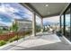 Covered patio with stylish outdoor seating and scenic views, perfect for relaxing and entertaining outdoors at 1465 Gentle Rain Dr, Castle Rock, CO 80109