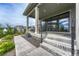 Covered outdoor patio featuring modern railings and landscaping that enhances its curb appeal and outdoor experience at 1465 Gentle Rain Dr, Castle Rock, CO 80109