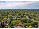 Residential area featuring charming homes with manicured lawns and tree-lined streets in suburbia at 6982 Estes Dr, Arvada, CO 80004