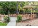 Picturesque backyard showcasing a charming gazebo, deck, and lush greenery at 6982 Estes Dr, Arvada, CO 80004