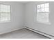 Bright bedroom features two windows allowing ample natural light to fill the room at 6982 Estes Dr, Arvada, CO 80004