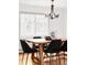 Elegant dining room with modern lighting and a spacious table at 6982 Estes Dr, Arvada, CO 80004