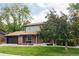 Inviting two-story home boasting brick accents, well-maintained lawn, and mature trees at 6982 Estes Dr, Arvada, CO 80004